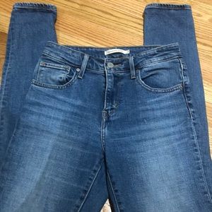 Levi High Rise Denim with Distressed Knees